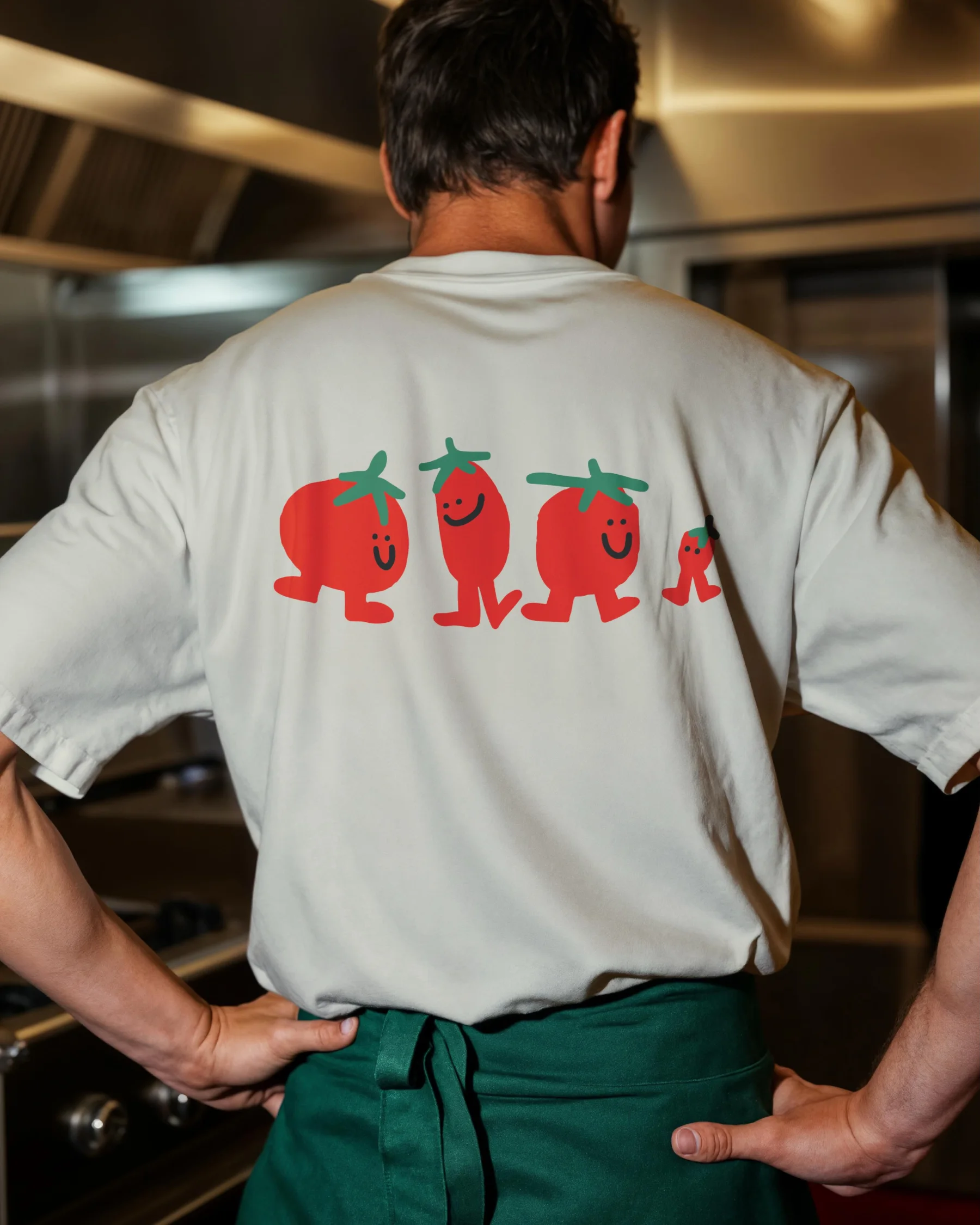 Les mascottes au dos d'un t-shirt de cuisine