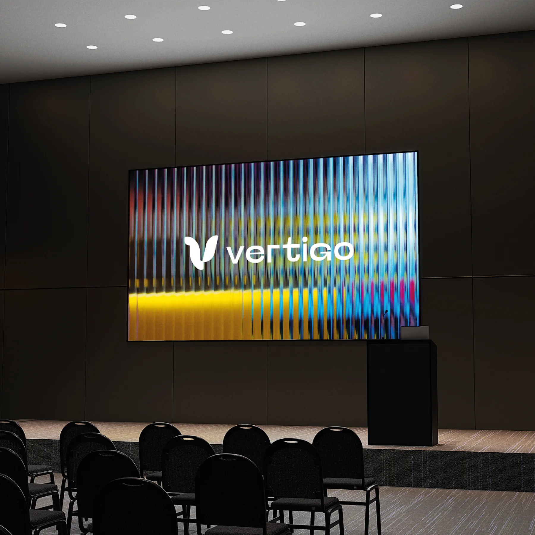 Le logo Vertigo sur l'écran d'une salle de conférence